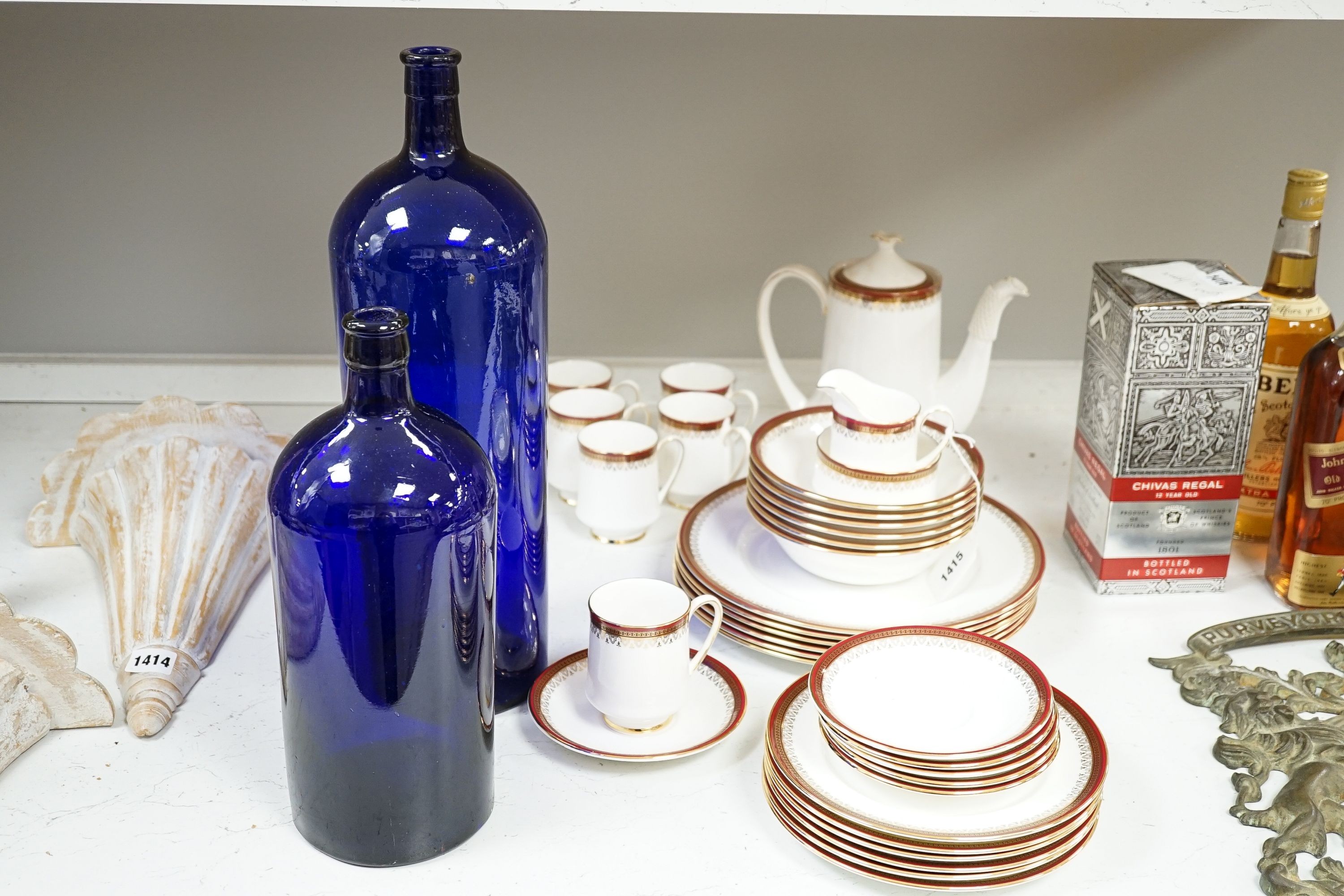 A Royal Albert Holyrood pattern dinner and coffee service and two deep blue pressed glass apothecary bottles